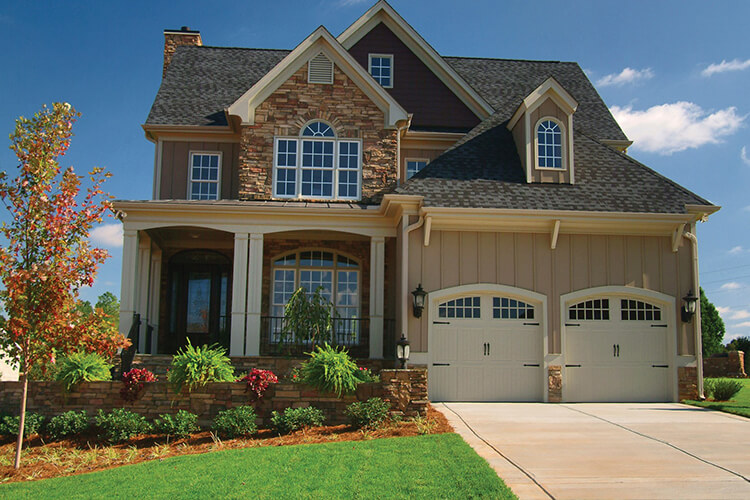 beautiful landscaping in front lawn of new home