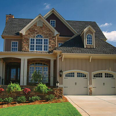 beautiful landscaping in front lawn of new home