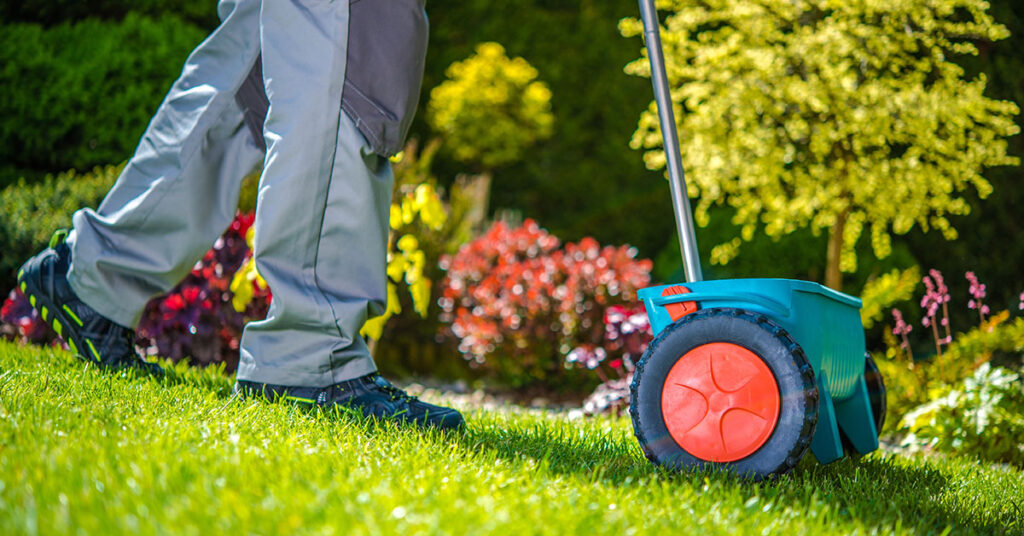 man dispersing Fertilizer